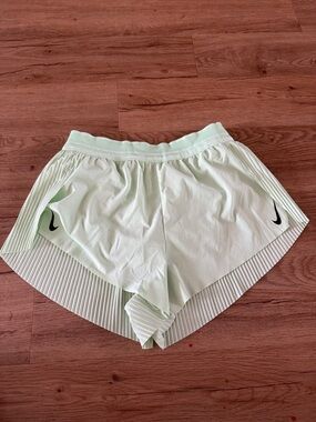 Nike Women's Mint Green Athletic Shorts with Black Swoosh
